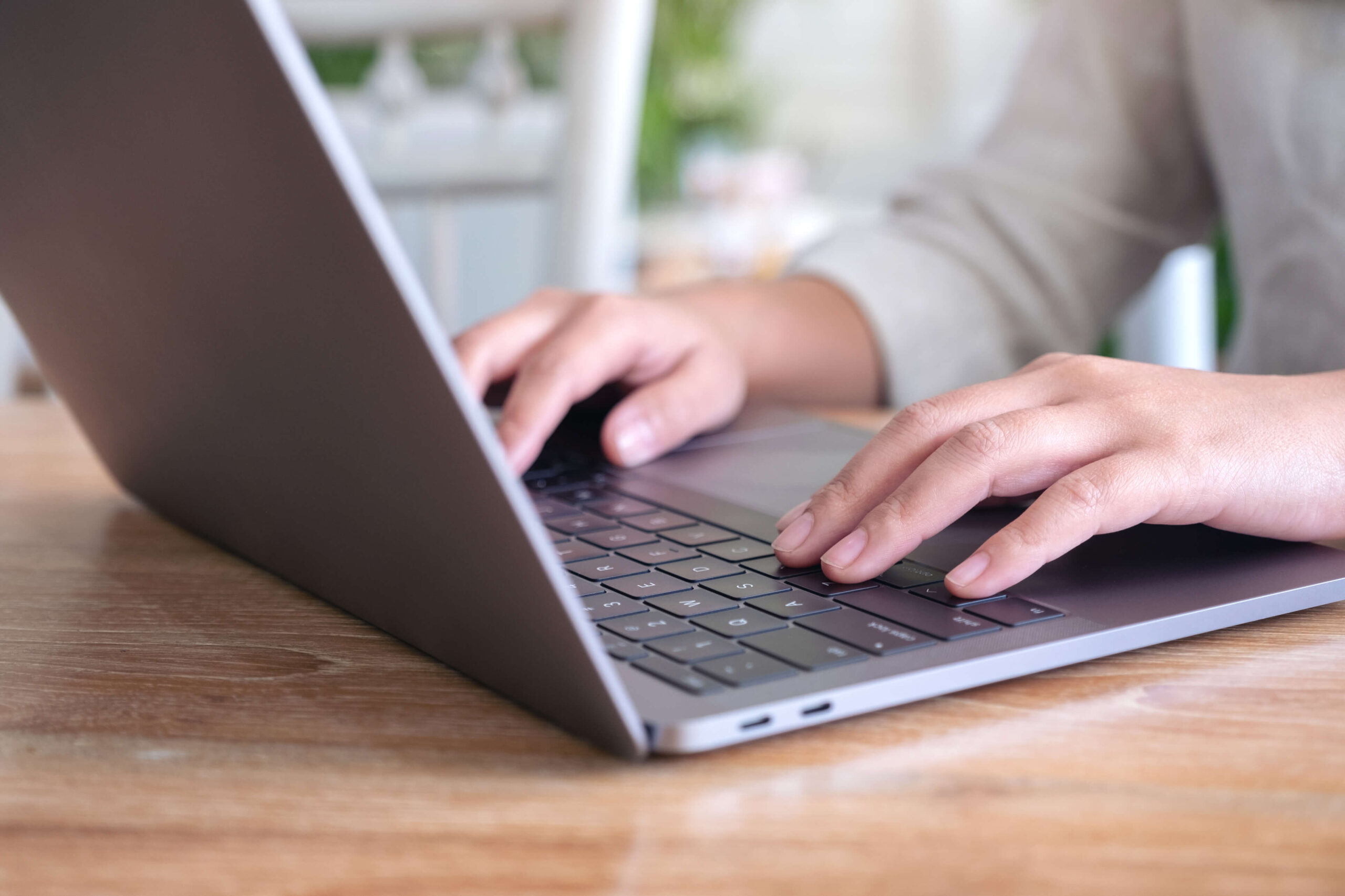 closeup-image-of-woman-s-hands-using-and-typing-on-2022-12-16-05-10-35-utc-1-scaled
