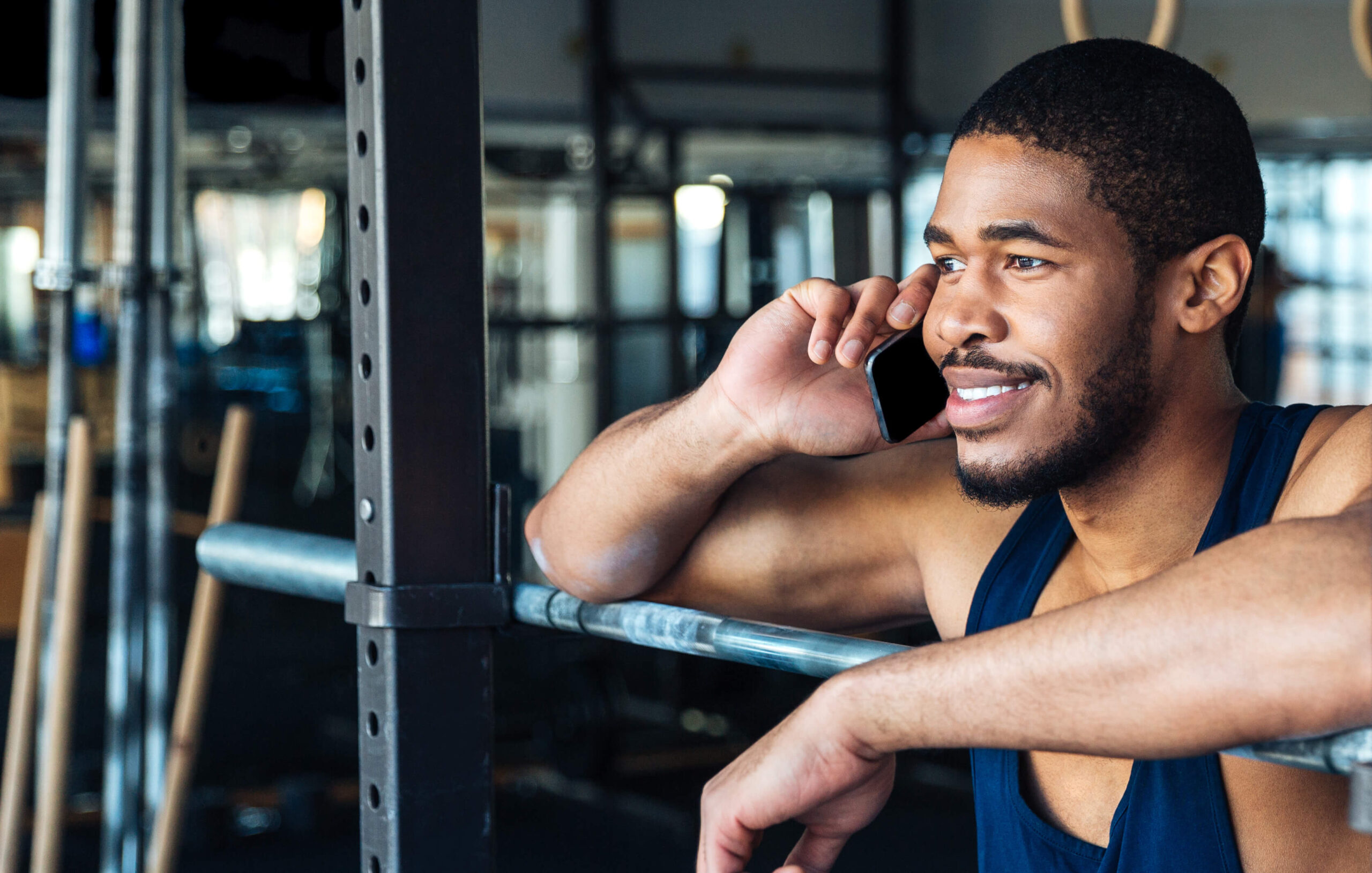 healthy-fitness-man-talking-on-the-smartphone-in-t-2021-08-26-18-19-43-utc-1-scaled