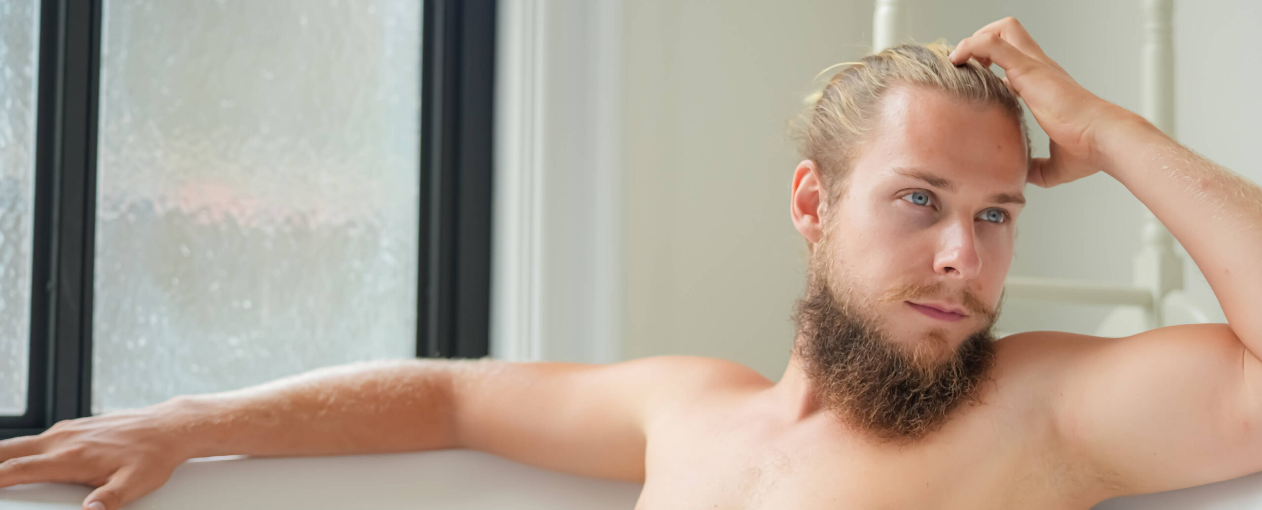 man-lying-in-bathtub-relaxed-young-man-bathing-in-2023-07-11-01-31-32-utc-1-scaled